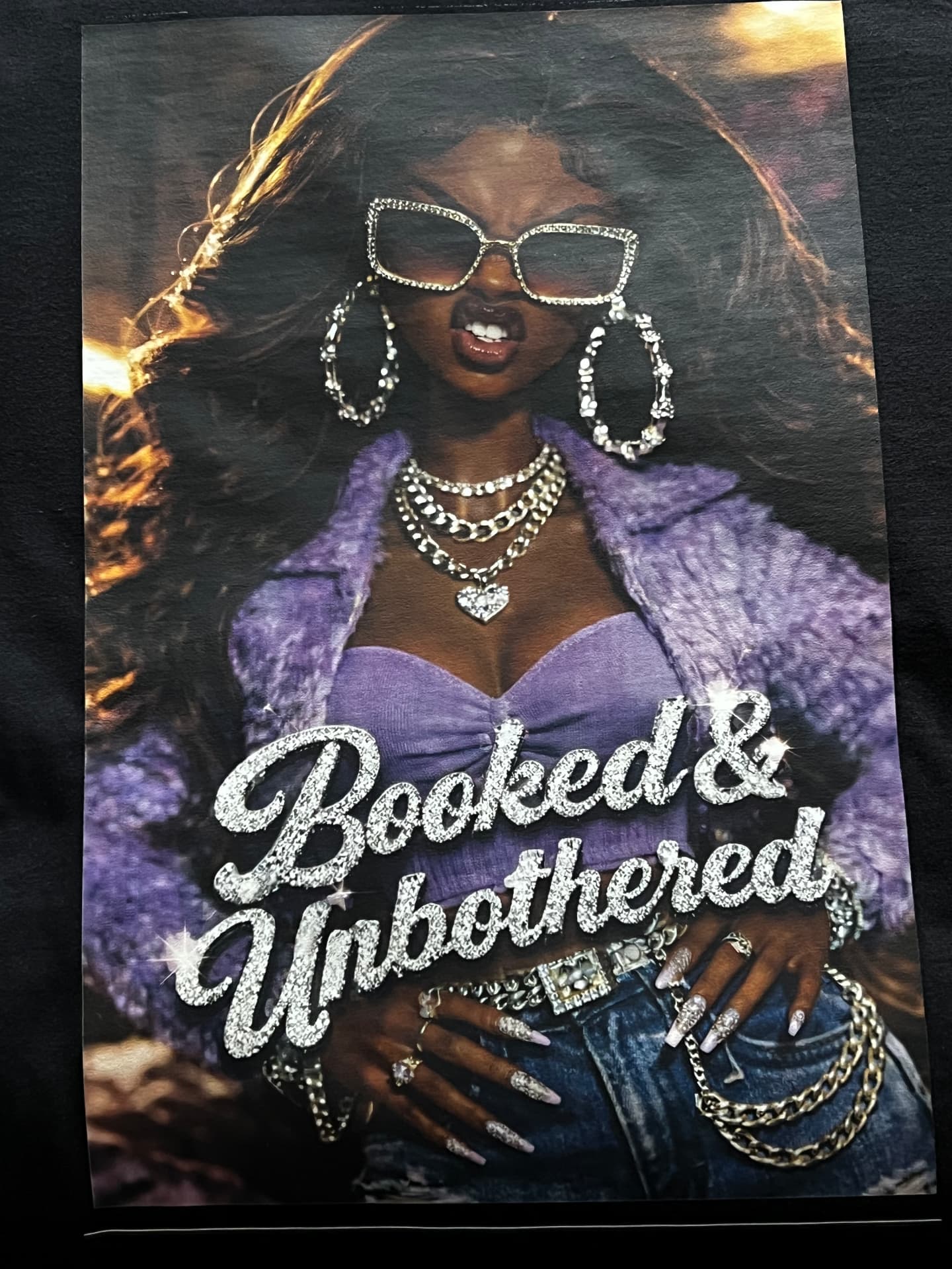 Full-color portrait design with sparkling Booked & Unbothered lettering printed on film