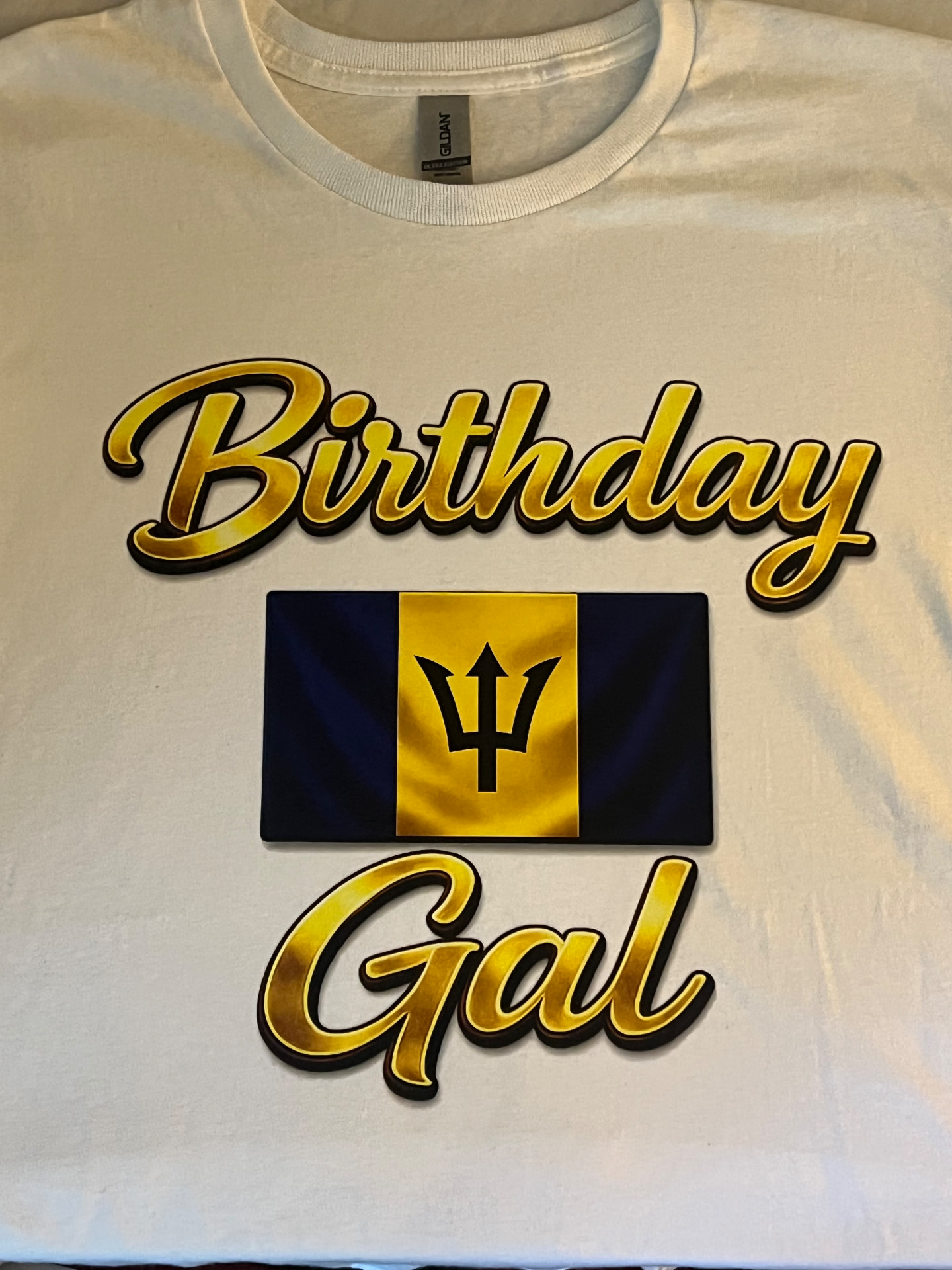 White t-shirt with a gold script Birthday Gal design and Barbados flag printed for a customer